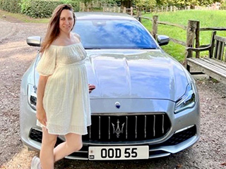 Oksana Zakharova with the number plate OOD 55